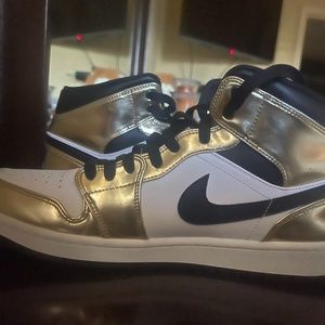 Jordan 1s black , gold ,and white